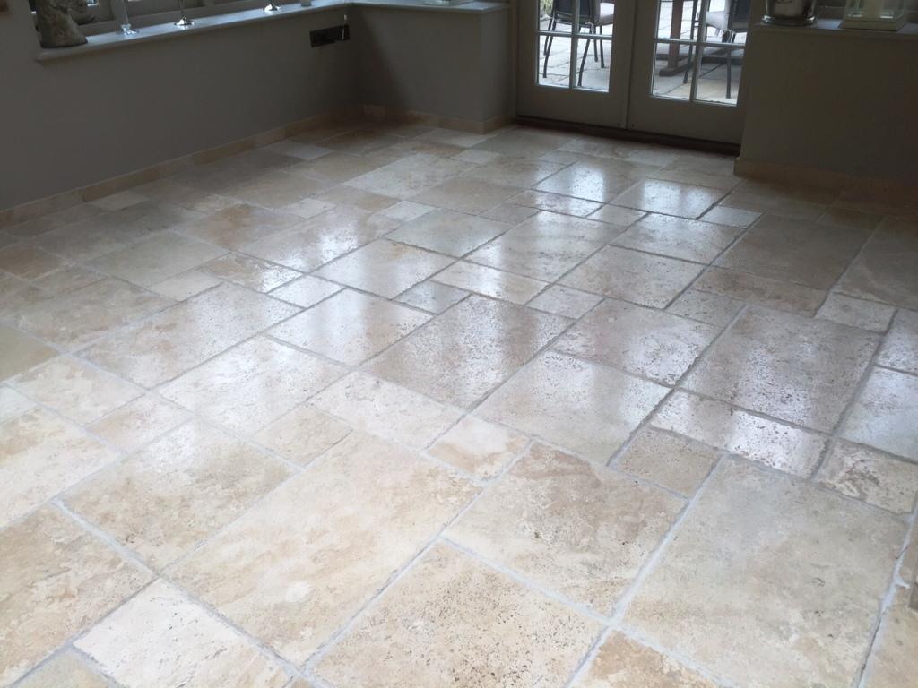 Pitted travertine floor tiles after burnishing in Andover